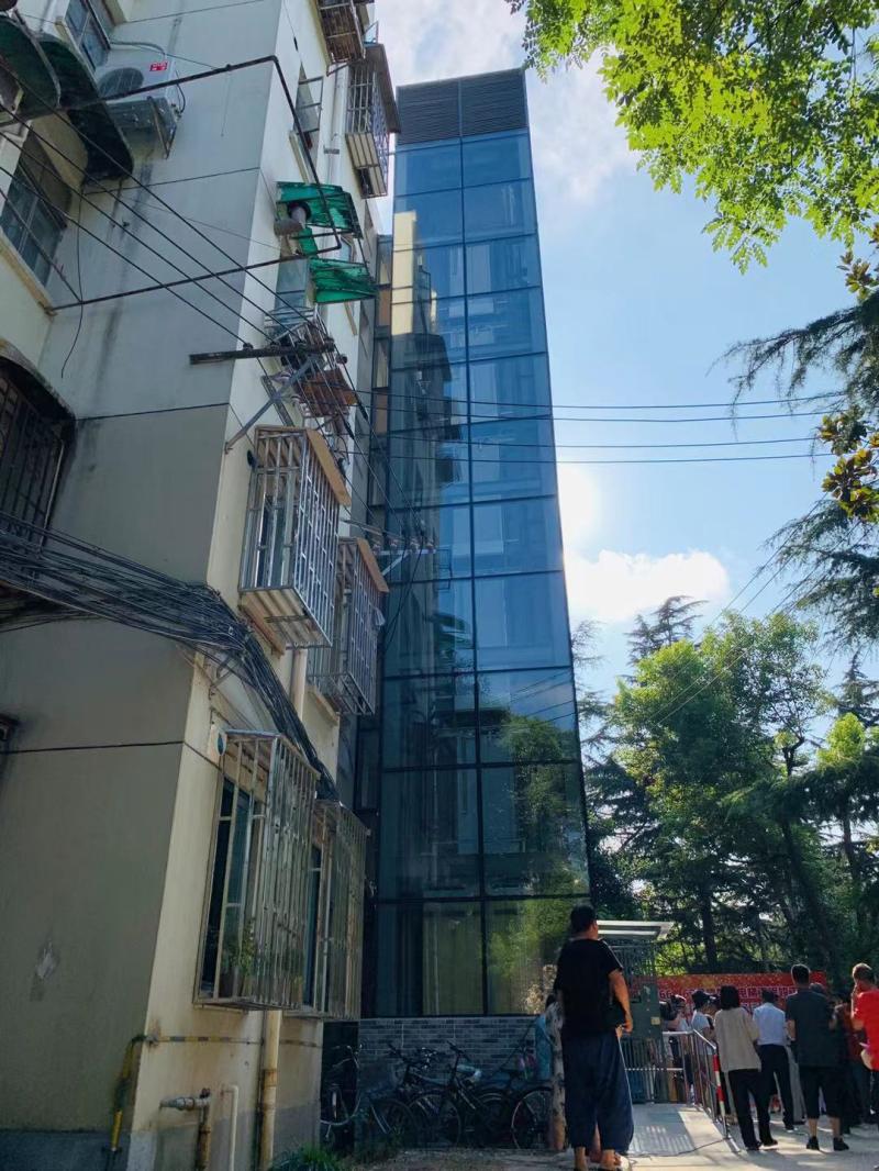 老旧小区0元装电梯?上海探索新模式,每月使用费200元,居民喜提电梯房