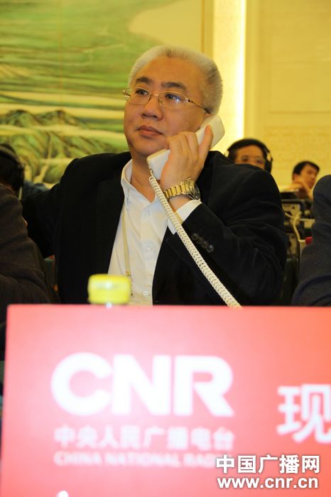 中央人民广播电台副总编辑刘晓龙在"中国加入世界贸易组织十周年高层